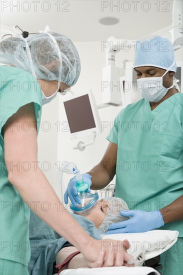 Doctors with patient in operating room