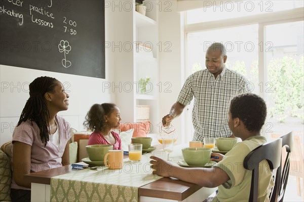 African American family eating breakfast