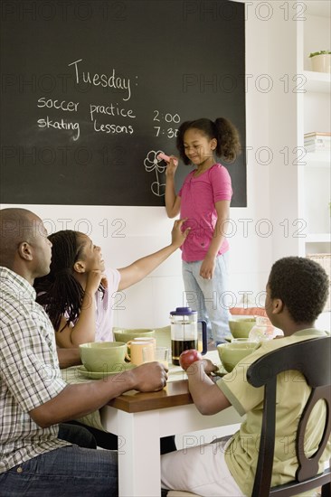 African American family eating breakfast