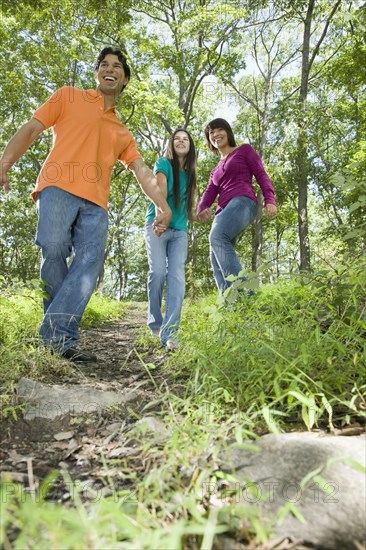 Family walking in forest