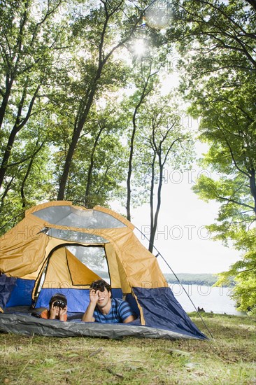 Mixed race father and son camping