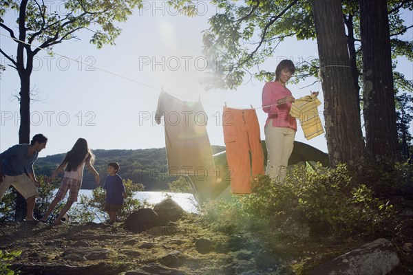 Family camping by lake