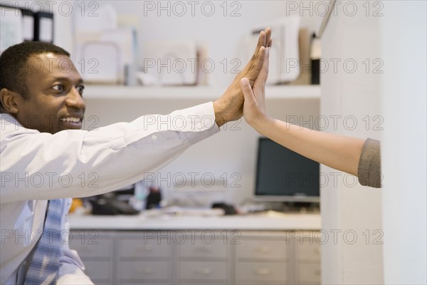 Business people high-fiving