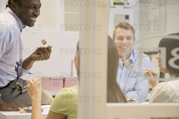 Business people eating lunch together