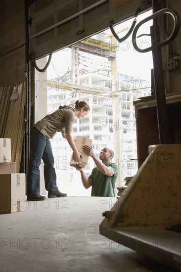 People working on warehouse loading dock