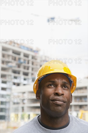 Black construction worker frowning