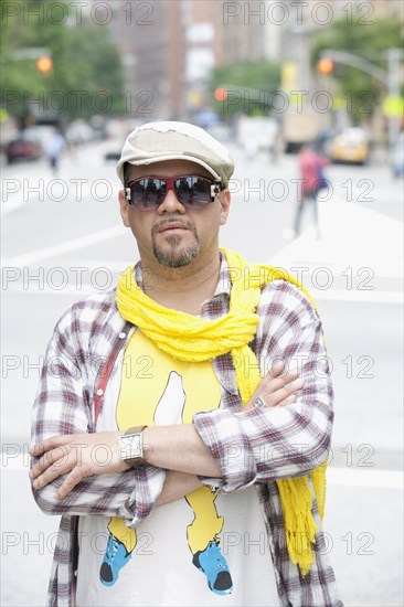 Hispanic man in unique clothing on urban street