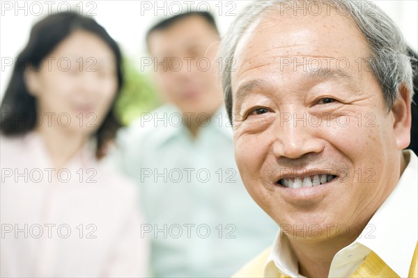 Smiling Chinese man with family