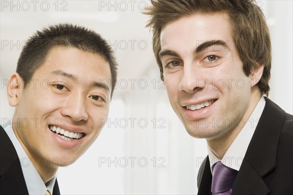 Businessmen smiling