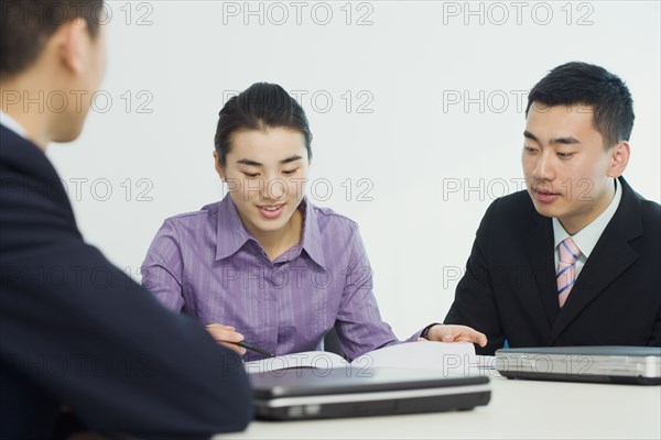 Chinese business people working together