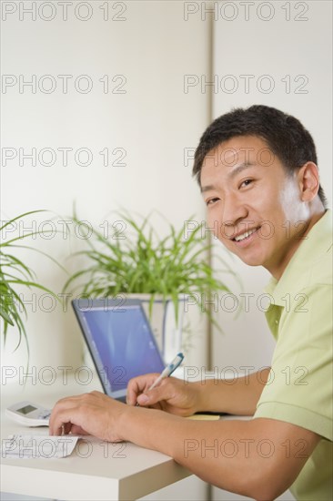 Chinese man using laptop