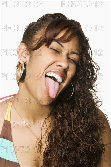 Pacific Islander woman sticking tongue out