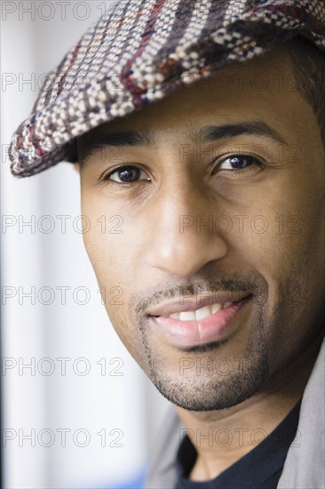 African American man wearing cap