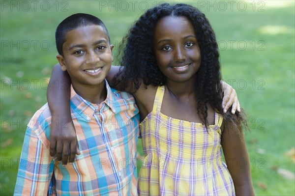 Smiling boy and girl hugging