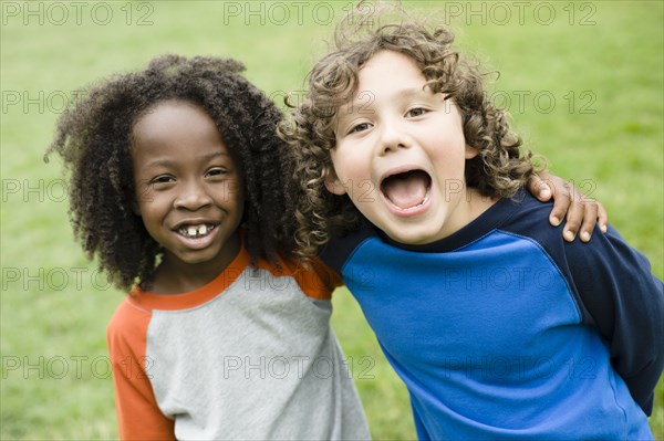 Boys smiling in park