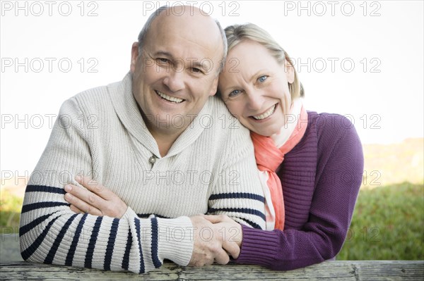 Caucasian couple hugging