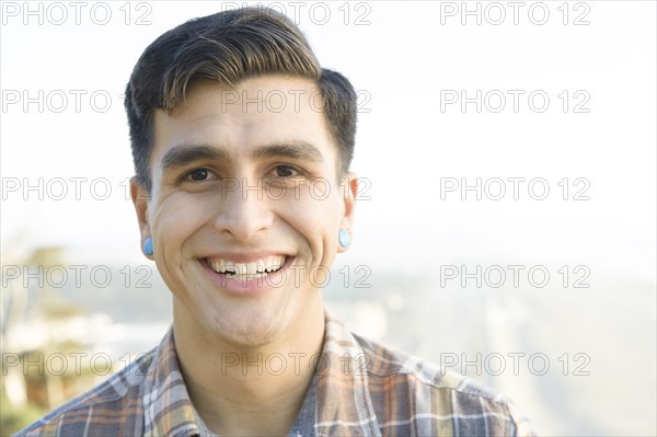 Smiling man standing outdoors