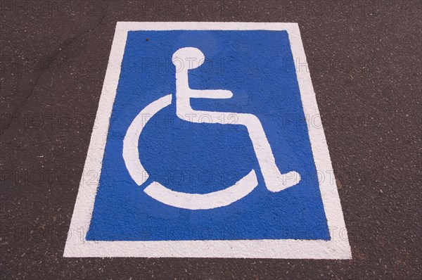 Handicapped symbol painted on pavement