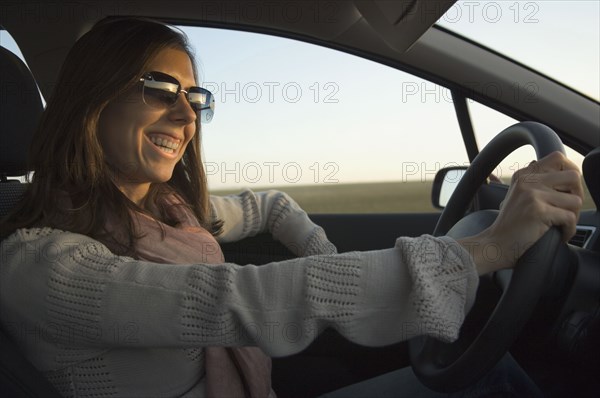 Young woman driving car