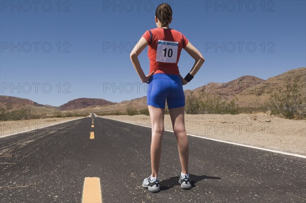 Mixed Race female runner on road