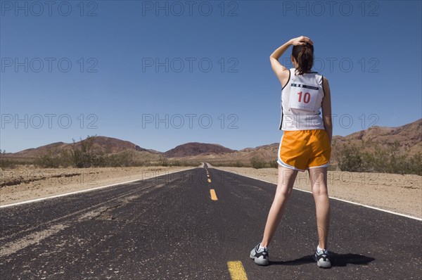 Mixed Race female runner on road