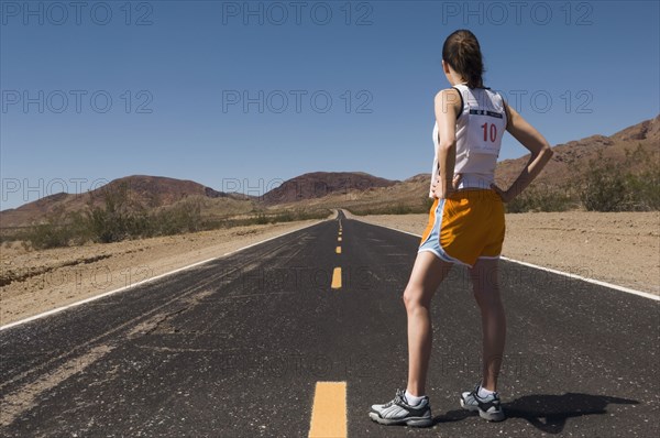 Mixed Race female runner on road