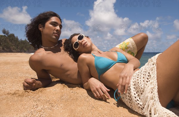 Couple laying on beach