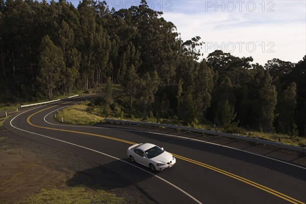 High angle view of car driving on winding road