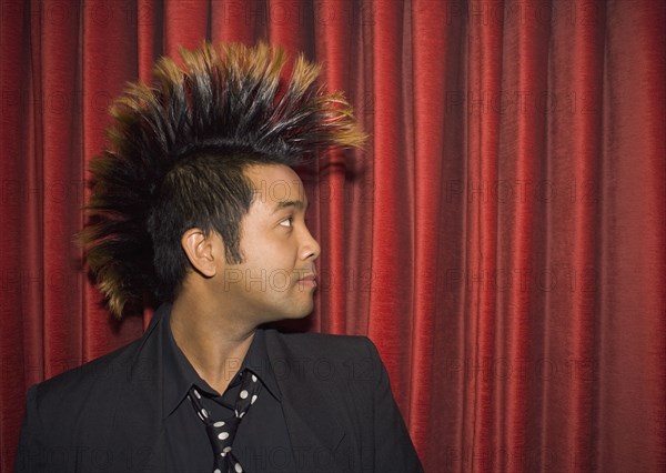 Pacific Islander man with mohawk