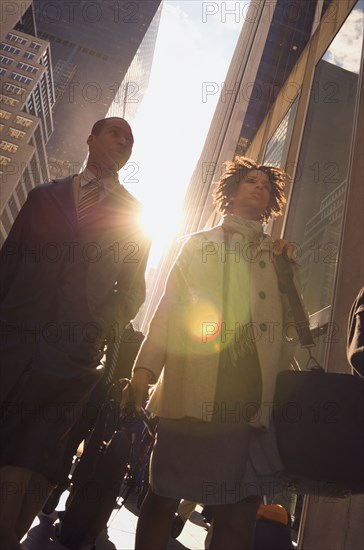 African American couple on urban sidewalk