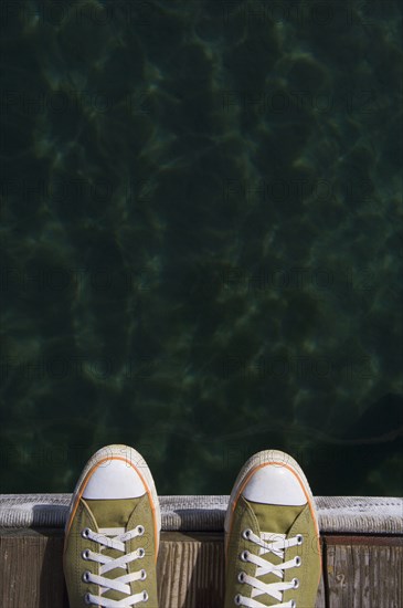 Sneakers on dock over water