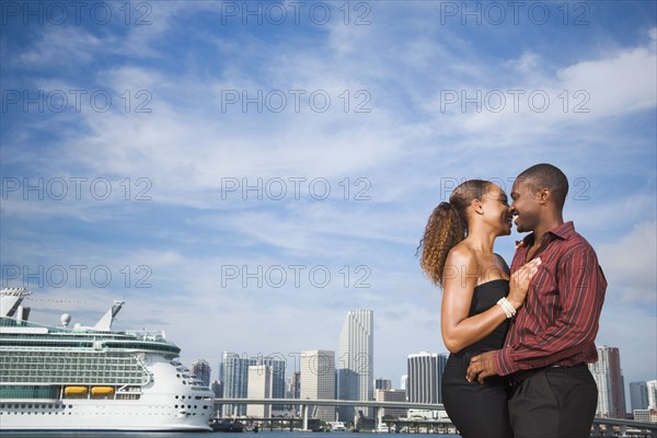 African American couple hugging