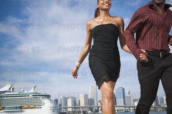 African American couple holding hands