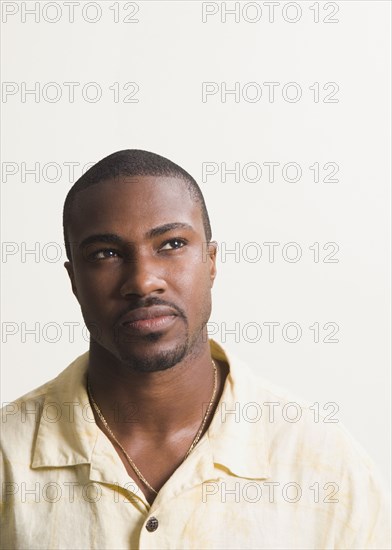 African man looking up