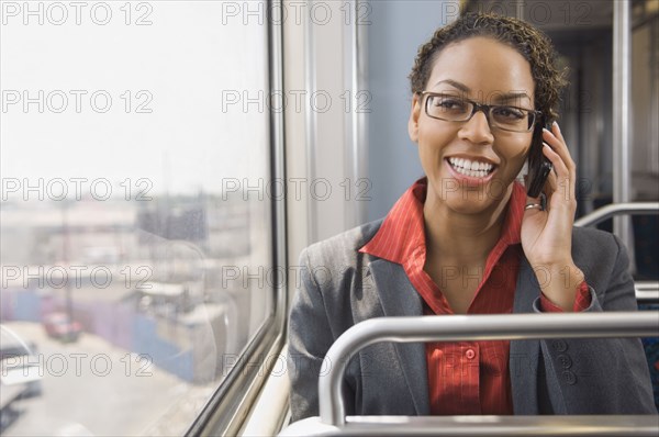 African businesswoman talking on cell phone