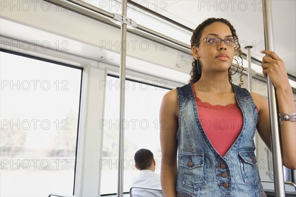 African woman riding on train