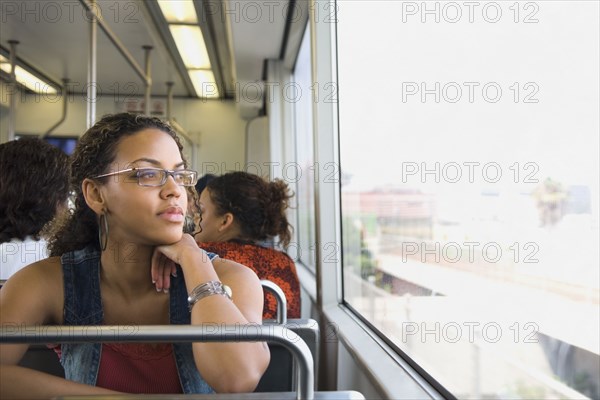 African woman riding on train