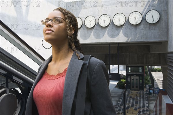 African businesswoman in train station