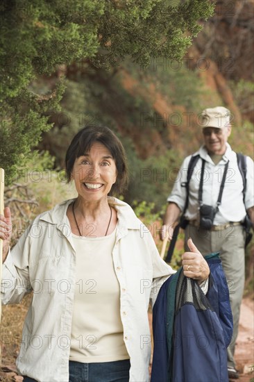 Multi-ethnic senior couple hiking