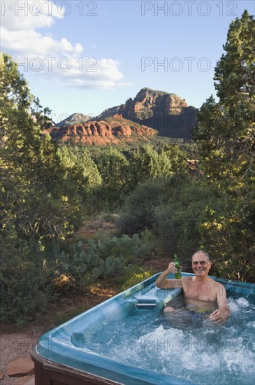 Senior man in hot tub