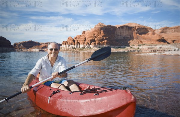 Senior man sitting in kayak