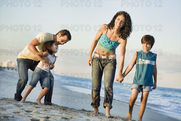 Family walking on beach