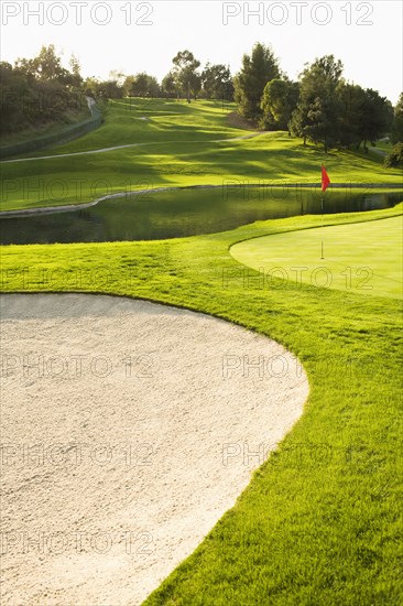 Sand trap and pond on golf course