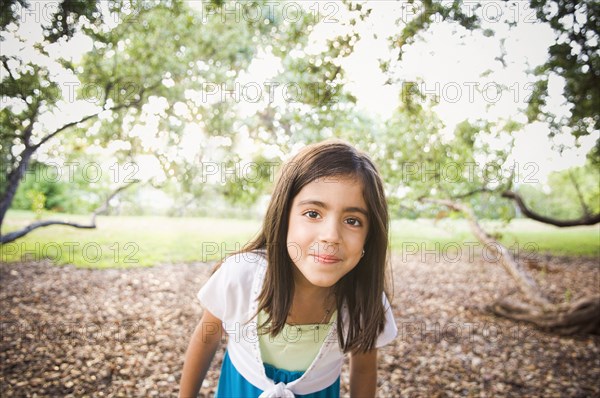 Mixed race girl standing outdoors