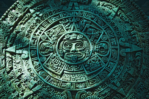 Green Aztec calendar stone carving