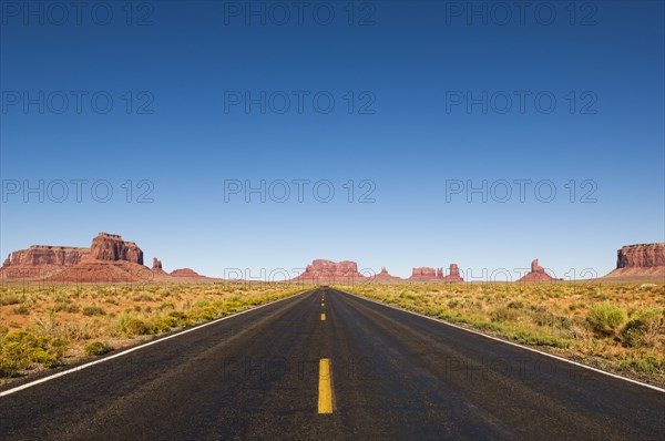 Highway and rock formations in desert