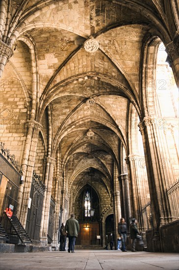 People visiting ornate cathedral