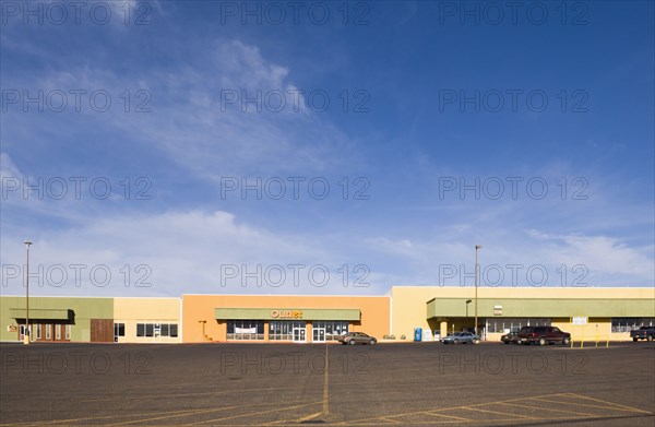 Empty parking lot in strip mall