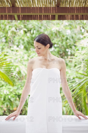 Caucasian woman in spa wrapped in a towel