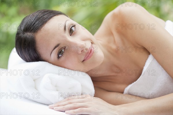 Caucasian woman laying on towel